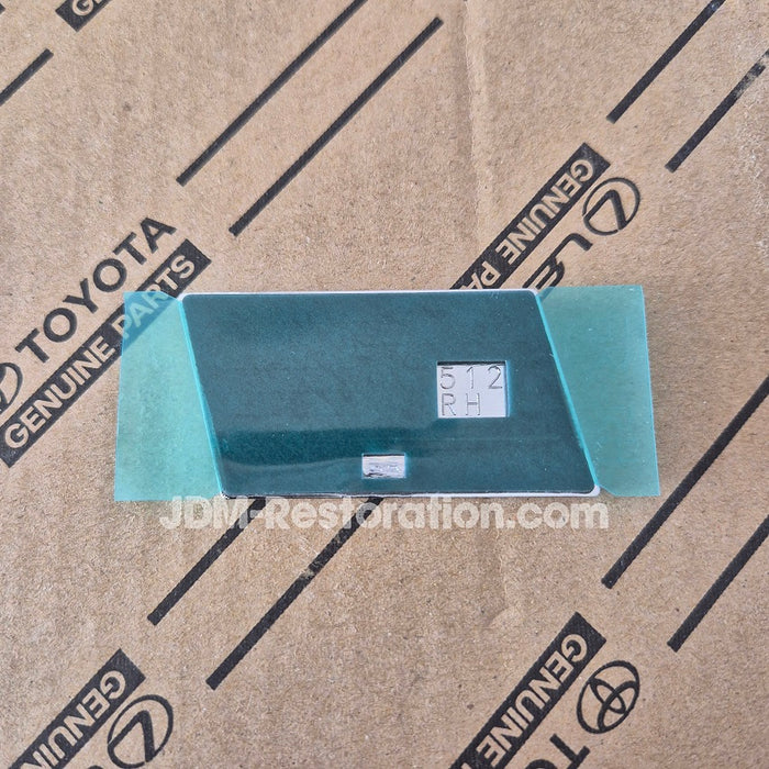 GR Badge on a cardboard background with Toyota branding