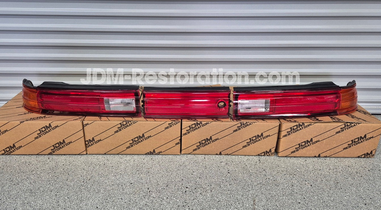 Set of Jzx90 Mark 2 Led Tail lights sitting on 4 JDM Restoration boxes
