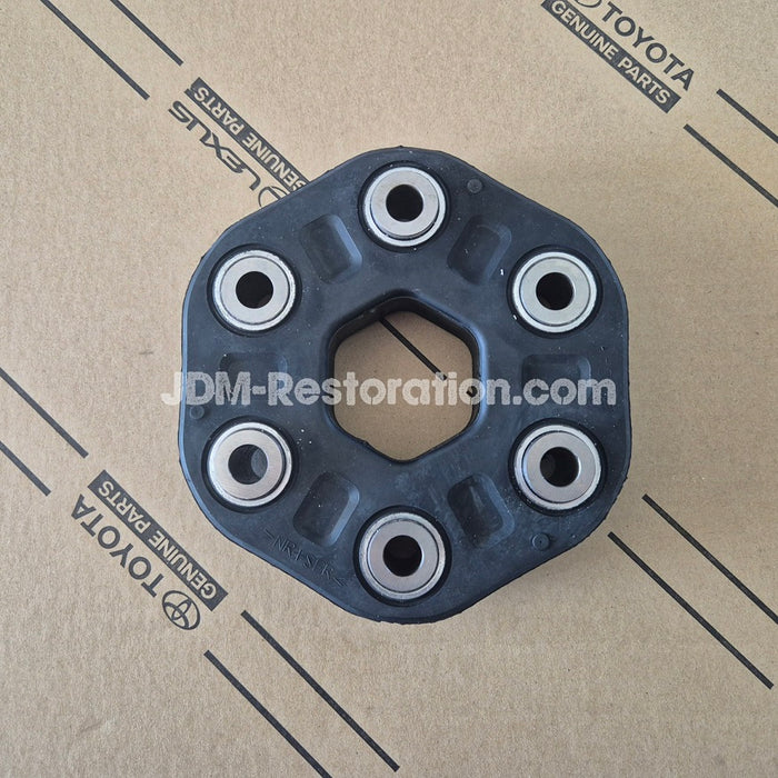 Toyota engine part on a cardboard background with 'JDM-Restoration.com' branding.
