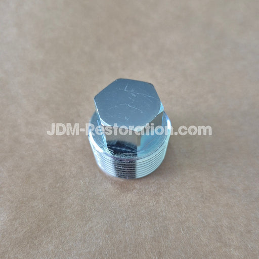 Metal hexagonal valve cap on a beige background with 'JDM-Restoration.com' branding.