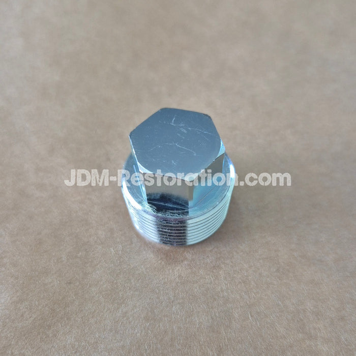 Metal hexagonal valve cap on a beige background with 'JDM-Restoration.com' branding.