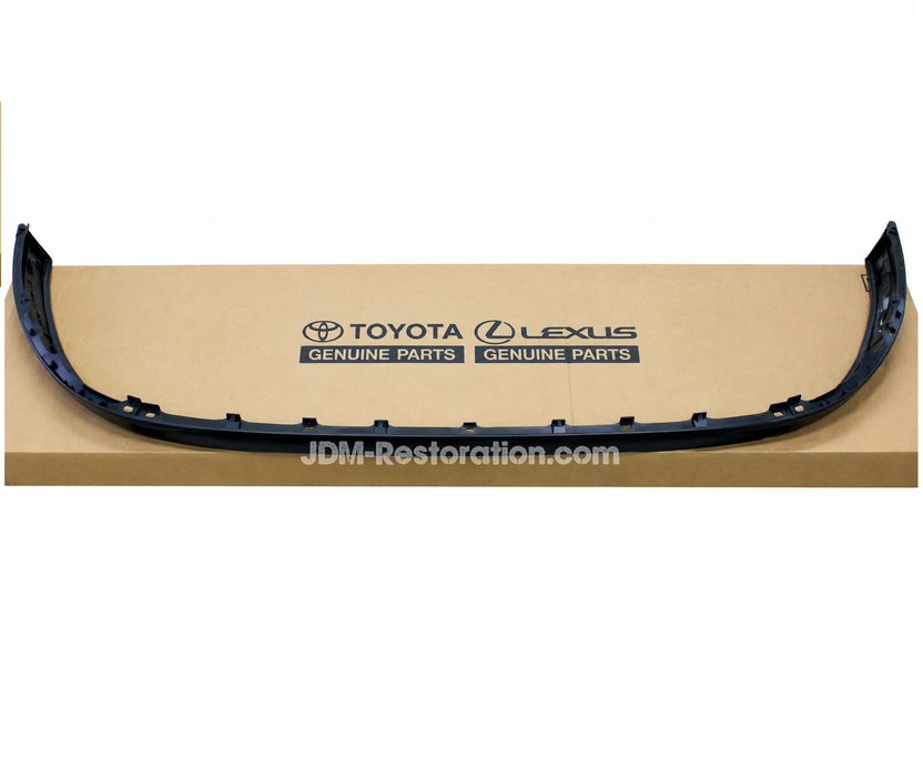 A black plastic automotive bumper trim piece displayed on top of a tan cardboard box printed with Toyota and Lexus Genuine Parts logos and a JDM-Restoration.com watermark.