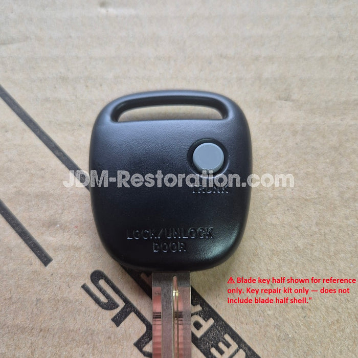 Car key fob on a cardboard background with 'JDM-Restoration.com' branding.