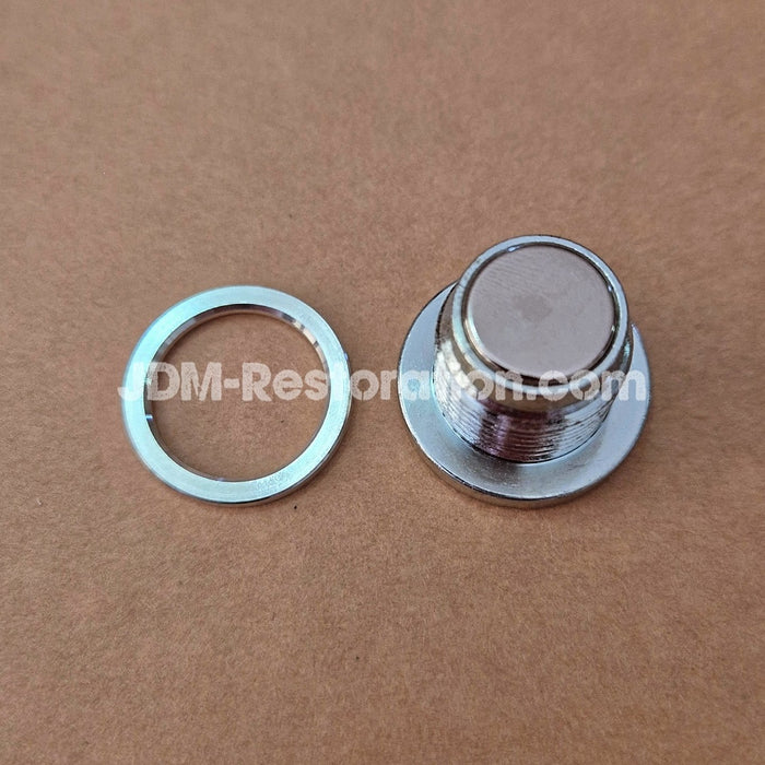 Metal knob and washer on a brown background with 'DM-Restoration.com' branding.