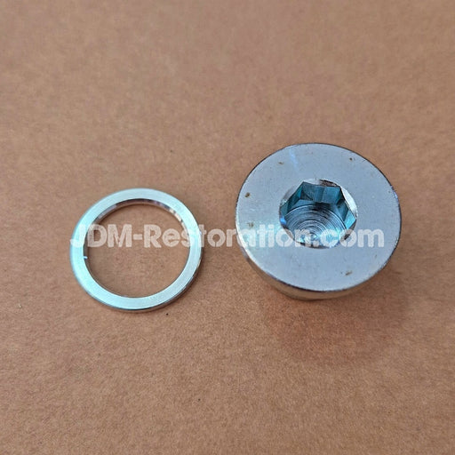 Metal washer and metal flange on a brown background with 'DM-Restoration.com' branding.
