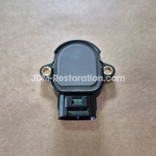 Black TPS unit on brown background 