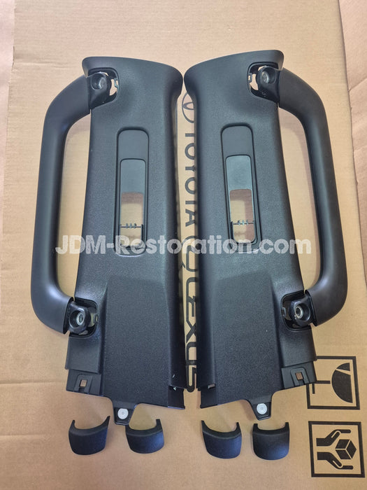 Two black car B Pillar Handles on a cardboard background with 'JDM-Restoration.com' branding.