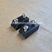 Two black rectangular metal mounting brackets with silver screws, shown on a textured tan background. A watermark 'JDMRestoration.