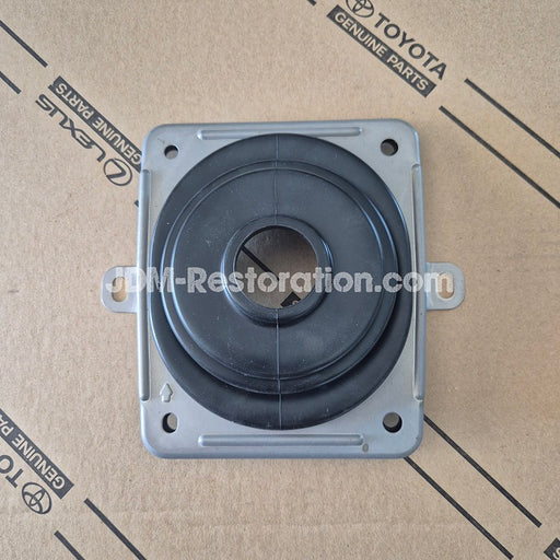 Mechanical component on a cardboard background with Toyota branding
