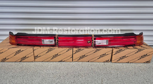 Set of Jzx90 Mark 2 Led Tail lights sitting on 4 JDM Restoration boxes 