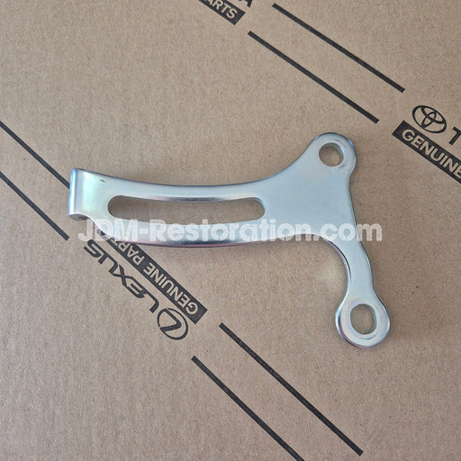 Metal bracket on a cardboard background with Toyota and Lexus branding.