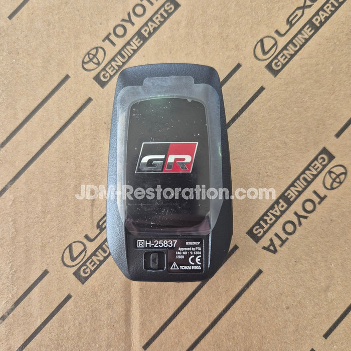 Car key fob with GR logo on a Toyota parts box