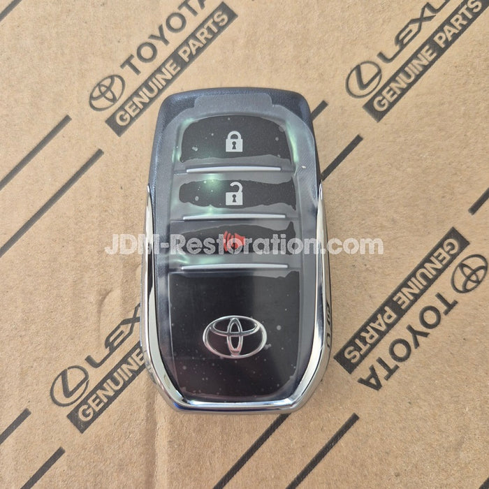 Car key fob on a cardboard box with Toyota and Lexus branding.