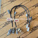 A pair of automotive wiring harnesses with multiple connectors and bulbs, laid out on a brown cardboard box printed with 'JDM Restoration'.