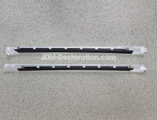 Two black car Door Belt Molds on a gray surface with 'JDM-Restoration.com' branding.