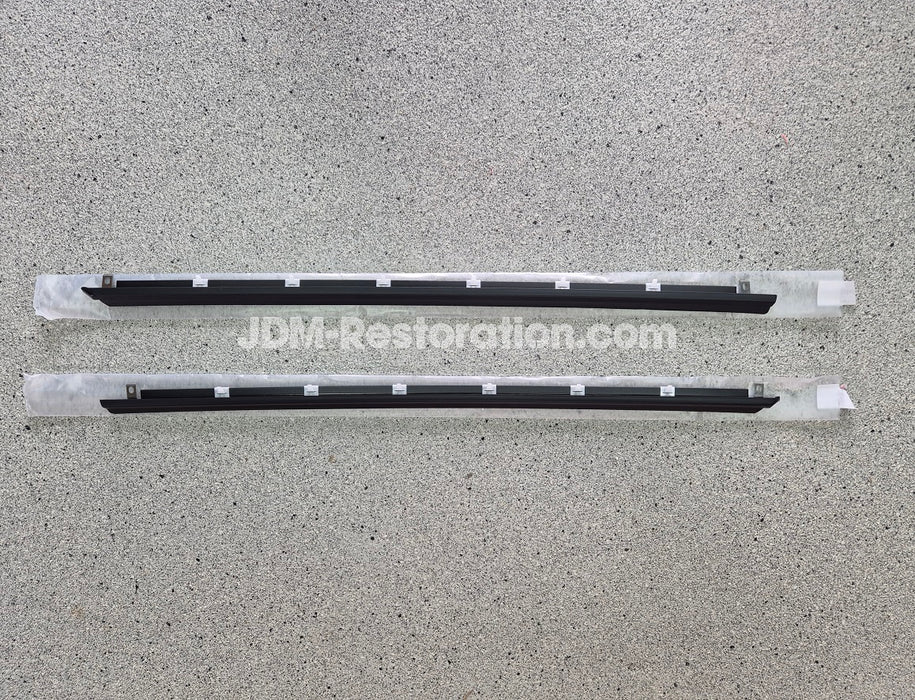 Two black car Door Belt Molds on a gray surface with 'JDM-Restoration.com' branding.