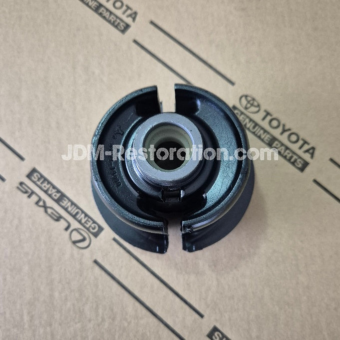 Black mechanical part on a Toyota branded cardboard background