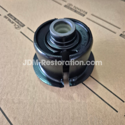Mechanical part on a cardboard surface with 'JDM-Restoration.com' branding.
