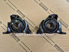Two black automotive parts on a cardboard background with Toyota branding.