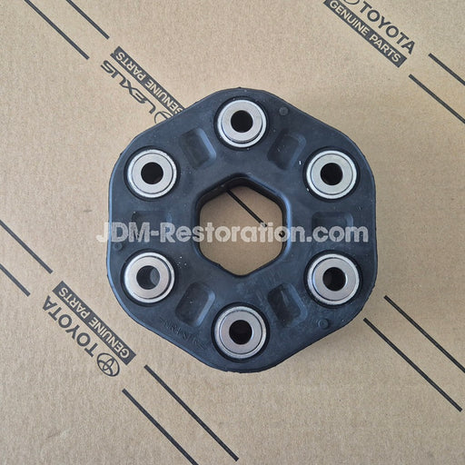 Toyota engine part on a cardboard background with 'JDM-Restoration.com' branding.