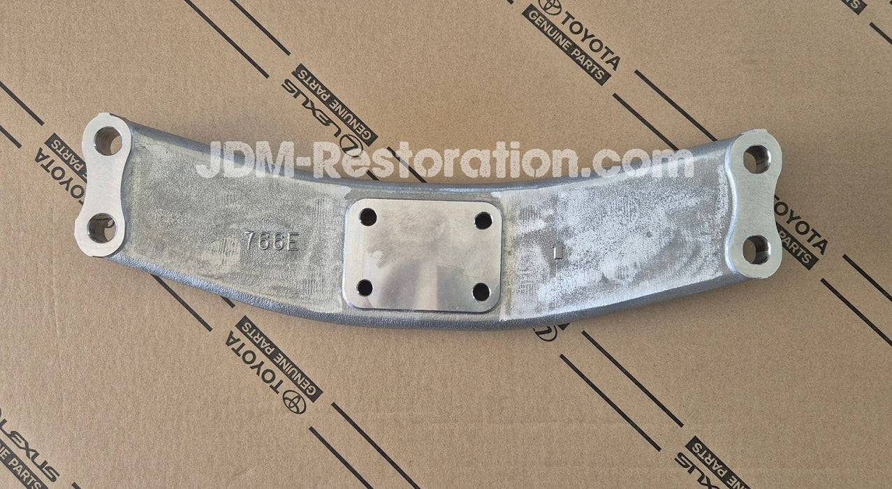 Metal component on a cardboard surface with 'JDM-Restoration.com' branding.