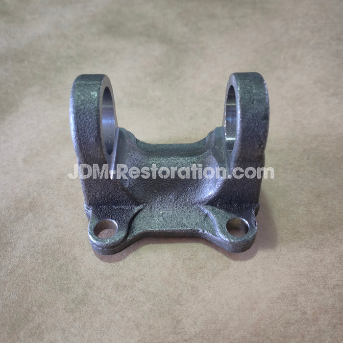 Tail shaft Flange component on a beige background with 'JDM-Restoration.com' text.Tail shaft Flange component on a beige background with 'JDM-Restoration.com' text.